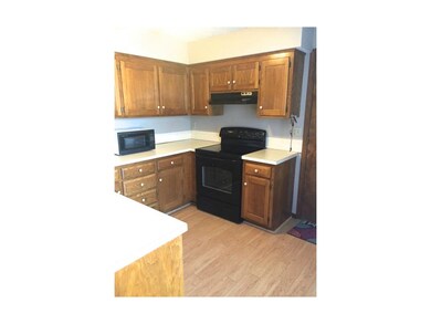 kitchen with new laminate floor, dishwasher, stove