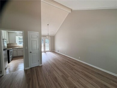 Unfurnished living room with beam ceiling, french doors, high vaulted ceiling, and dark wood-style flooring