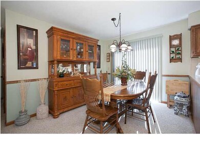 Dining Room has a sliding glass door to the wood d