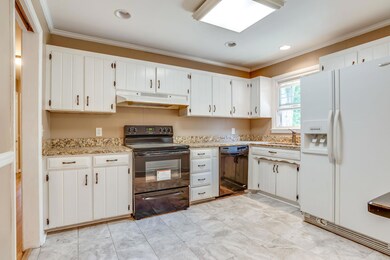 Another view of this large kitchen