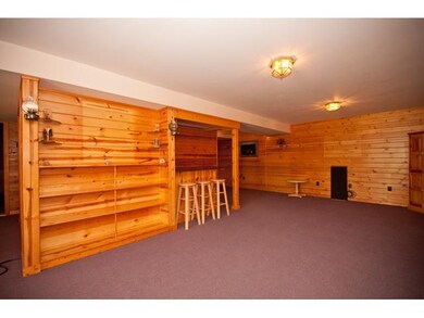 Basement. The walk out basement could be what ever you wanted it to be.  The mini bar is a plus and around the corner you will find the workshop that is ventilated outside so you could cut wood, clue, or paint and no odor or dust will enter the rest 