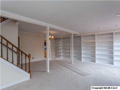 Wall of bookshelves can handle a library of books and a life time of mementos.