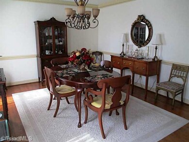 Dining Room. HW Floors, Crown Molding, Chair rail.