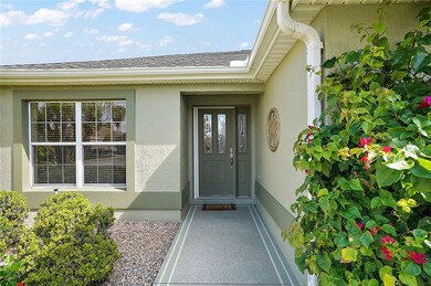 Covered front entry with elegant leaded glass door