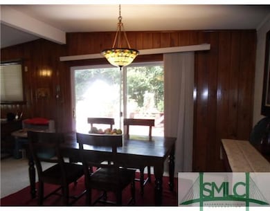 Dining Room. DINING AREA OVERLOOKING LARGE DECK .