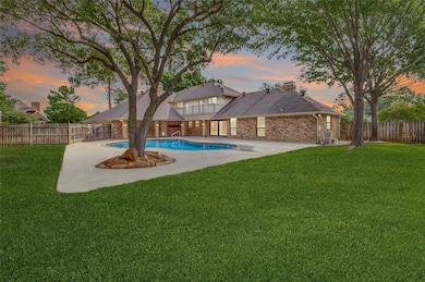 View of backyard, pool, and home