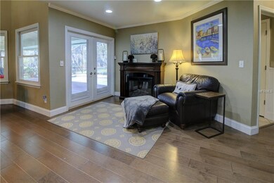Reading nook with French doors leading to pool