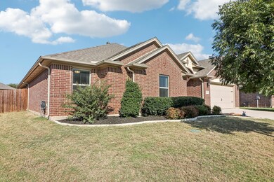 View of front of house with a front lawn and a gar