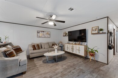 Living room with hallway to secondary bath and 2 b