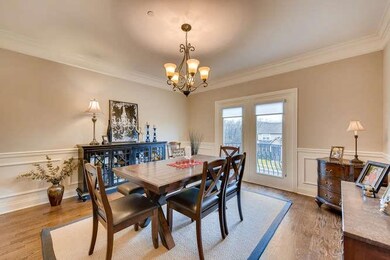 Large dining room with full-sized windows overlooking gorgeous views.  Plenty of trim in here, too!