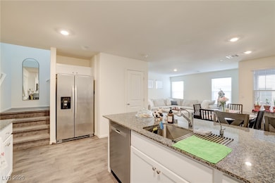 Kitchen featuring stainless steel appliances, ligh
