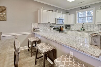 Kitchen with a kitchen breakfast bar, stainless st