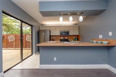 LOVELY OPEN KITCHEN WITH BRAND NEW GE MATTE STAINLESS STEEL APPLIANCES 