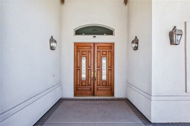 Entrance to property with stucco siding