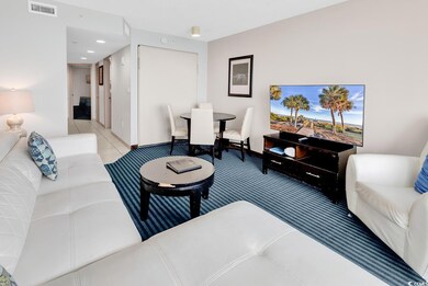 Living room featuring light tile patterned floors, recessed lighting, visible vents, and light colored carpet