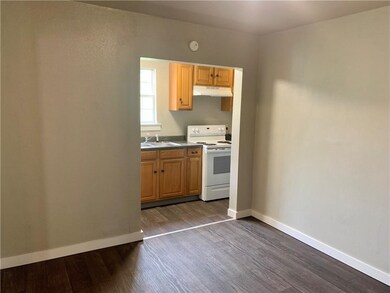 View from dining room into kitchen area. New floor