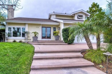 Wide custom paved entry from driveway