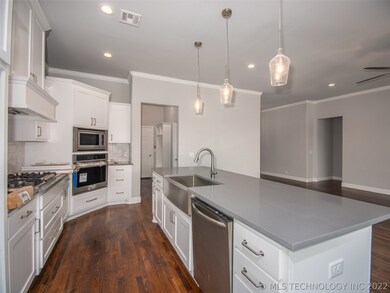 Kitchen with all stainless steel appliances and mo