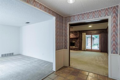Large family room with brick wood-burning fireplac