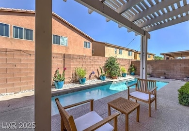 View of swimming pool featuring a fenced backyard, a patio, and a pergola