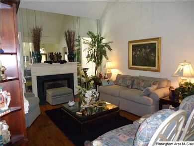 Great room with fireplace and cathedral ceiling an