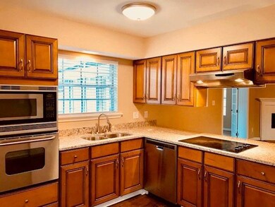 Kitchen with granite counters, maple cabinets, SS