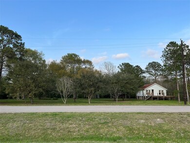 This is taken from across the street, in front of the detention pond, looking at the 1930's house the seller's family hopes to move.
