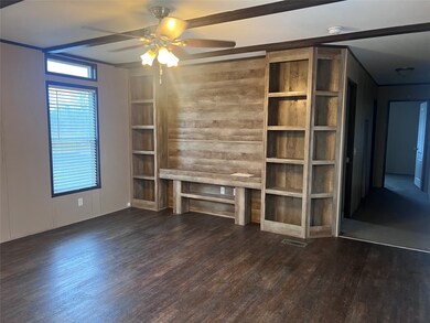 View of living area with great built-in shelving s