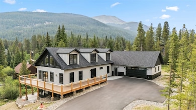 Side angle of the home showing the paved driveway