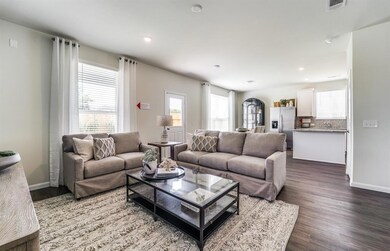 Island kitchen overlooks dining and living areas *