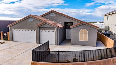 View of front of house with stucco siding, concret