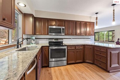 Stainless appliances. KitchenAid dishwasher, GE el