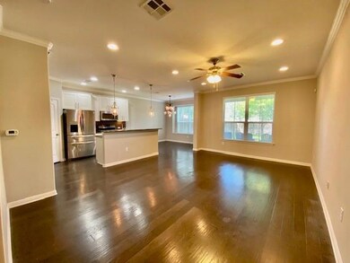 Unfurnished living room with crown molding, reces