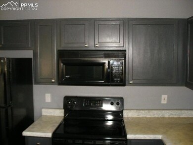 Kitchen featuring black appliances