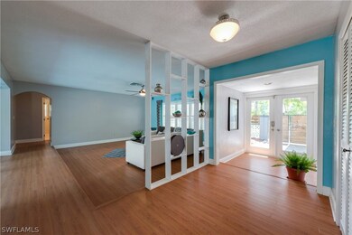 FOYER AND LARGE SUNKEN LIVING AREA.