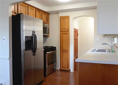 Kitchen, leading to side door and basement