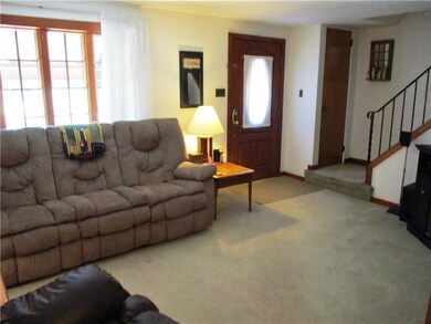 Large open living room with large, newer window wh