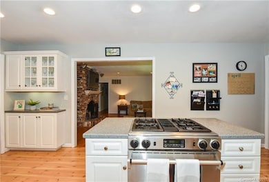 Updated kitchen with gas stove, island and butler'