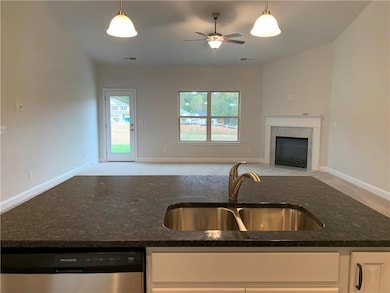 Kitchen featuring stainless steel dishwasher, visi