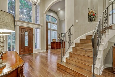 First study to the left with arched ceilings and formal dining (not pictured) to the right