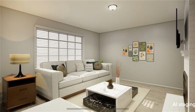 Living room featuring baseboards and wood finished