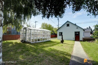 Green house & sidewalk to garage