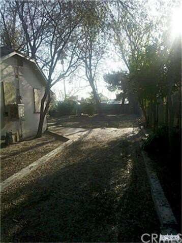 long driveway to back of house. unpermitted  garag