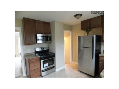 Second view of the new gas range with built in microwave,new easy care floor covering.