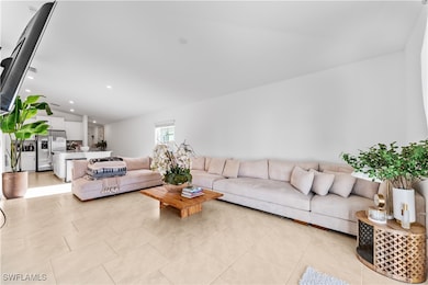 Living room featuring light tile patterned floors