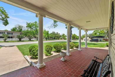 Covered porch with a yard