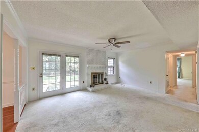Large, sunny family room opens up to the breakfast