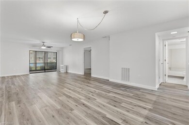 Unfurnished living room with light wood-style flooring, ceiling fan, and baseboards