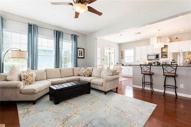 Family room with kitchen and french doors to breez