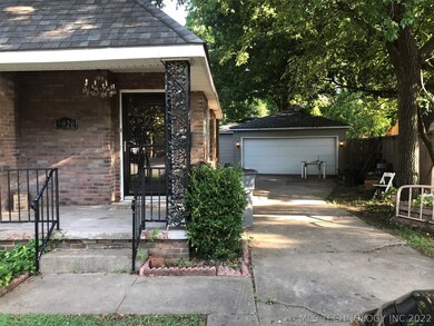 Front porch, 2 car garage w/ shop in back
